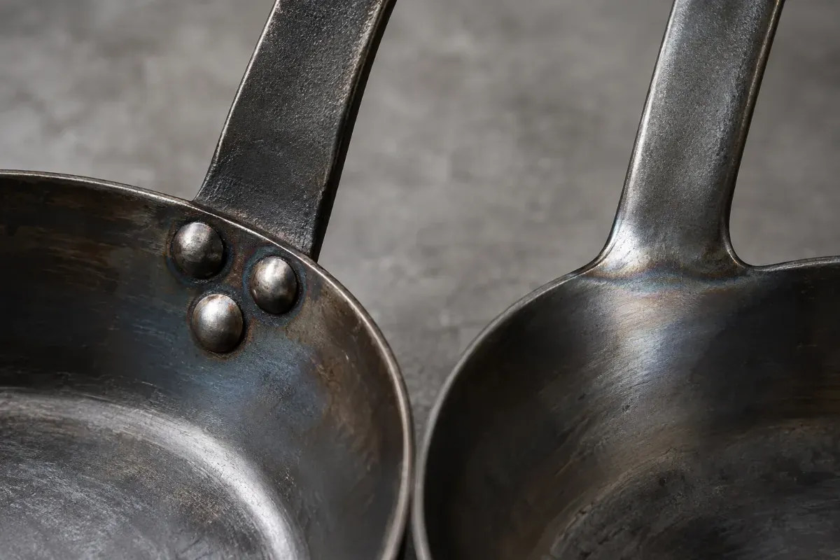 Riveted versus welded carbon steel pan handle joints