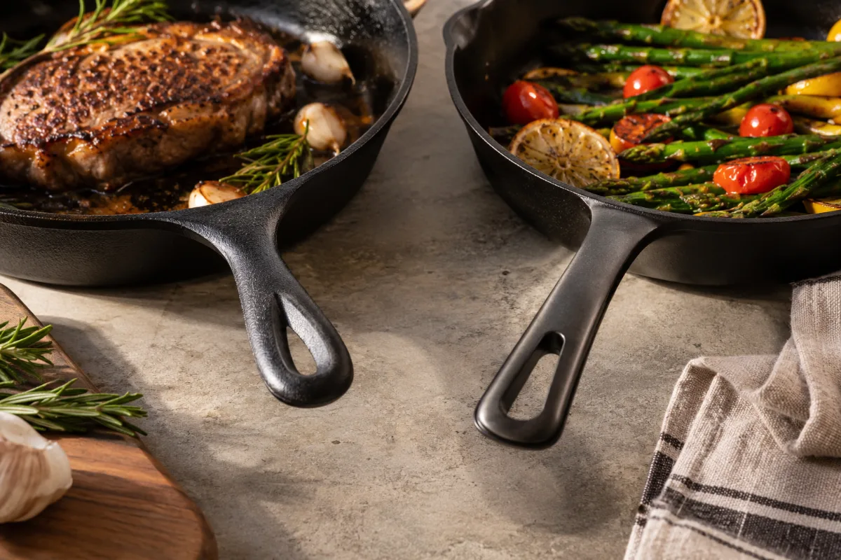 Lodge basic handle next to Made In designed handle